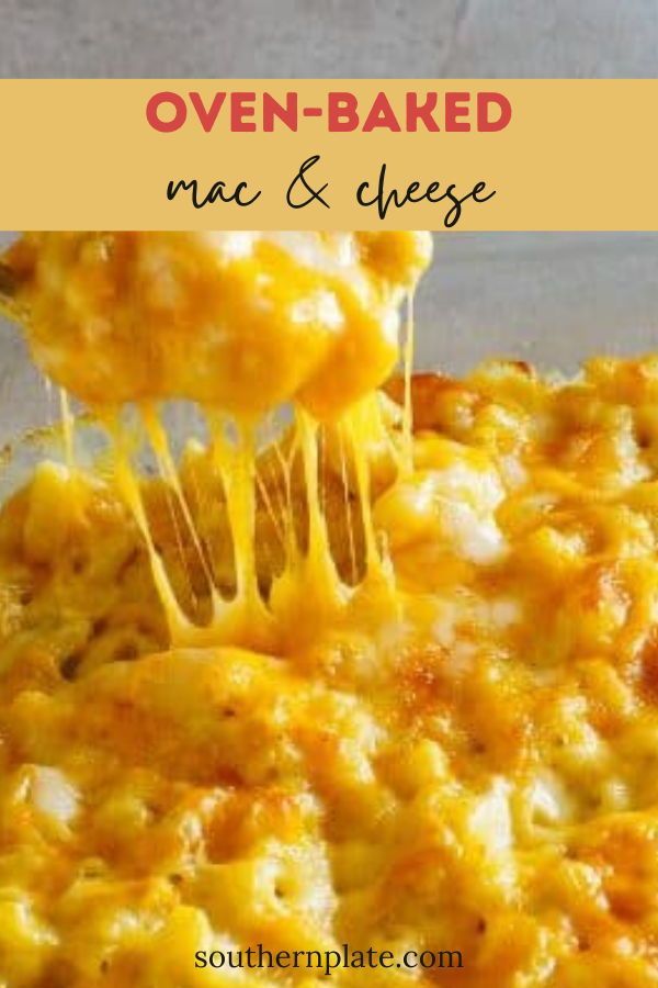 a close up of food with cheese being lifted from the casserole dish by a spatula