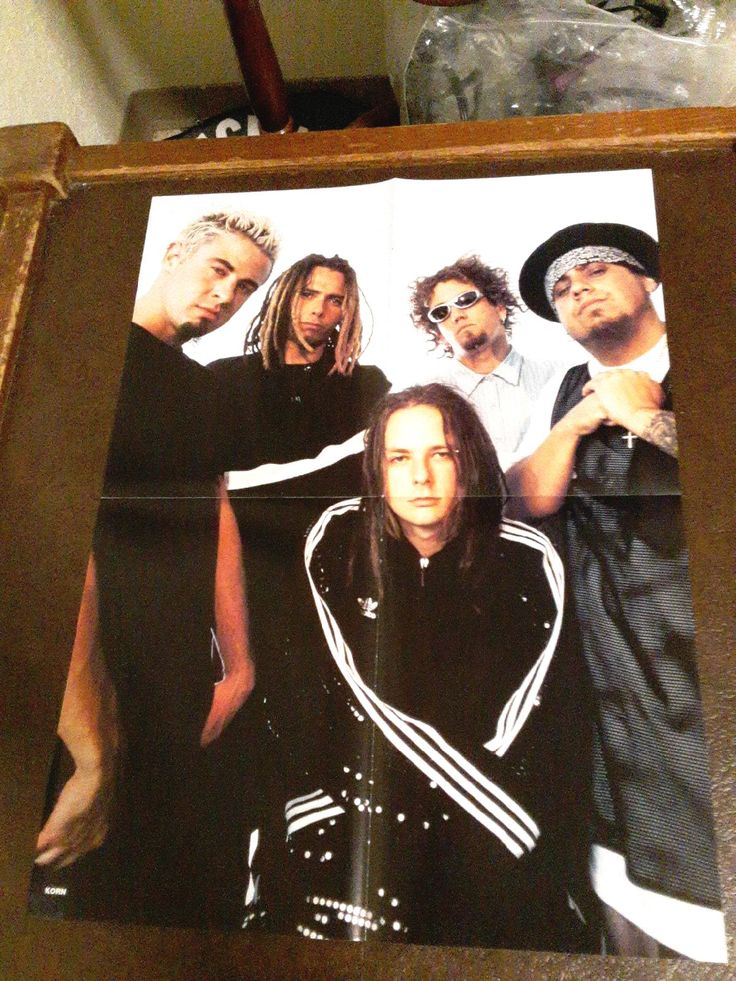 an image of a group of people on a piece of paper in a wooden frame