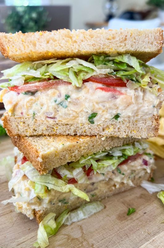 a close up of a sandwich on a cutting board