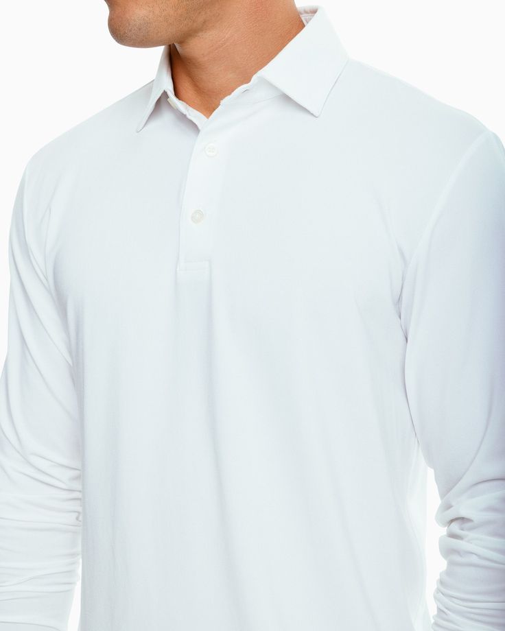 It doesn’t get any better than this – a classic long sleeve men's polo with all the performance features you love. Pair with our Gulf Shorts for the perfect preppy look. Style: 8431 Classic Fit Model is 6'1 wearing a size M 88% Polyester 12% Stretch Outline Skipjack heat seal on back neck Open chest and sleeve cuffs T3 tagless feel for comfort 2-piece self collar 3-button placket with white branded buttons Drop tail hem Soft and breathable fabric UV Protection Stretch for ease of movement Moistu Classic White Collared Polo Sweater, Classic Long Sleeve Golf Top, White Sporty Polo Sweater With Polo Collar, Sporty White Polo Sweater With Polo Collar, Classic Long Sleeve Solid Polo Shirt, Sporty White Long Sleeve Polo Sweater, Sporty White Polo Sweater, White Long Sleeve Golf Tops, Preppy Boys Outfits