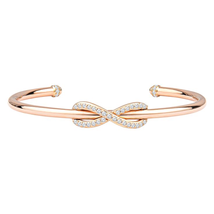 This classic Tiffany & Co. Diamond Infinity Cuff is a sleek, modern, 18kt rose gold piece with 0.39ctw in round diamonds encrusting the infinity symbol and topping the ends of the cuff. The diamonds are of D-F color, VS-VVS quality. The bracelet is a size medium, which fits up to about a size 6.5. This bracelet is brand new, and comes with the box and pouch. MSRP is $4750. Hallmark states T & Co. AU 750 Italy. Tiffany Bangle, Rose Gold Cuff Bracelet, Diamond Cuff Bracelet, Diamond Bracelet Design, Tiffany Bracelets, Rose Gold Bangle, Modern Bracelets, Cartier Panthere, Gold For Sale