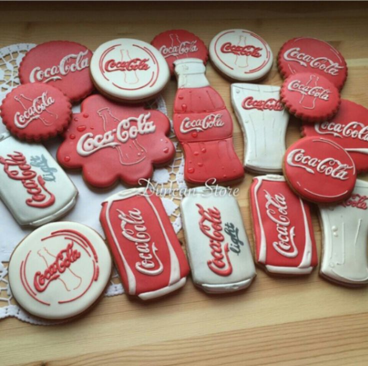 coca - cola cookies are laid out on a doily