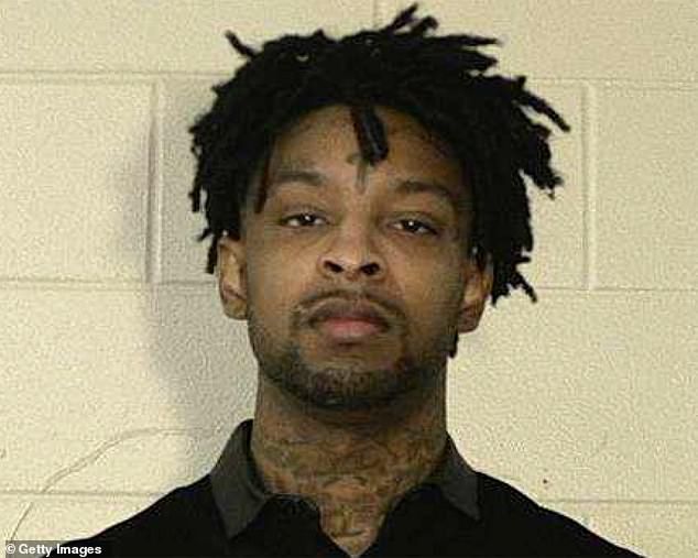 a man with dreadlocks is shown in this muggy mug shot from the side