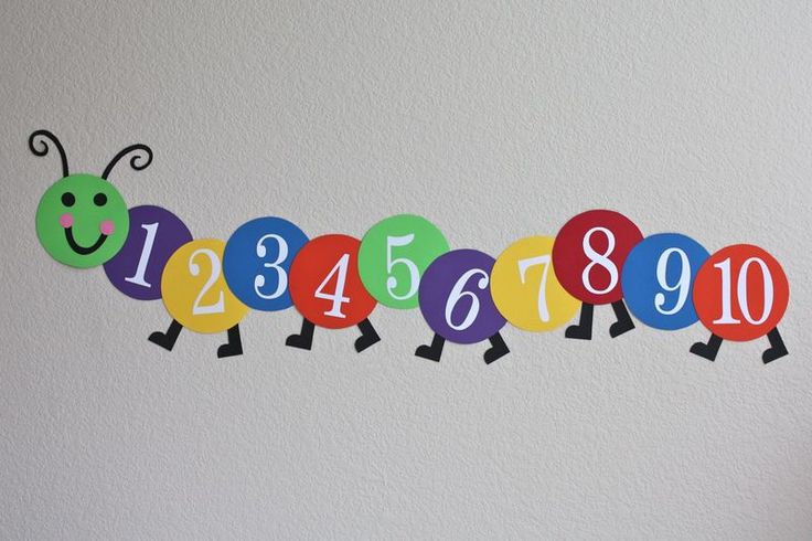 a number line made out of balloons with numbers on them and one balloon in the middle