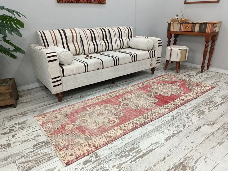 a living room filled with furniture and a rug