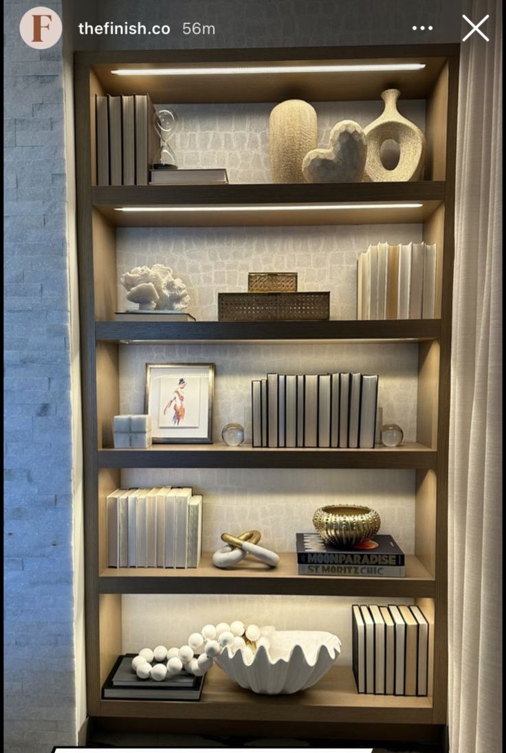 a book shelf filled with books and vases