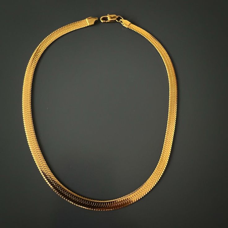 Italian Gold Choker Fashion Necklace is a radiant embodiment of timeless elegance and modern chic. This exquisite choker necklace combines Italian style with the luxury of 18k gold plating on durable stainless steel. The result is a piece that seamlessly blends sophistication with a touch of simplicity, making it the perfect accessory for those who appreciate understated glamour. Whether worn alone or paired with different lengths and styles, this choker effortlessly complements a variety of out Understated Glamour, Gold Fashion Necklace, Stylish Necklace, Gold Choker, Steel Necklace, Modern Chic, Polish Jewelry, Stainless Steel Necklace, Italian Style