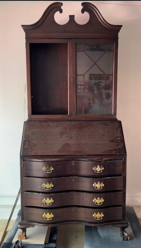 an old wooden desk with many drawers