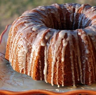 a bundt cake with icing on a plate