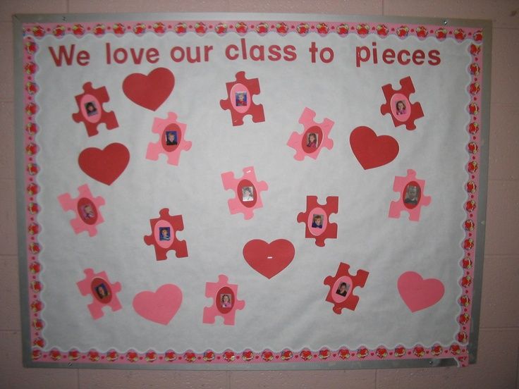 a bulletin board with pink and red hearts on it that says we love our class to pieces