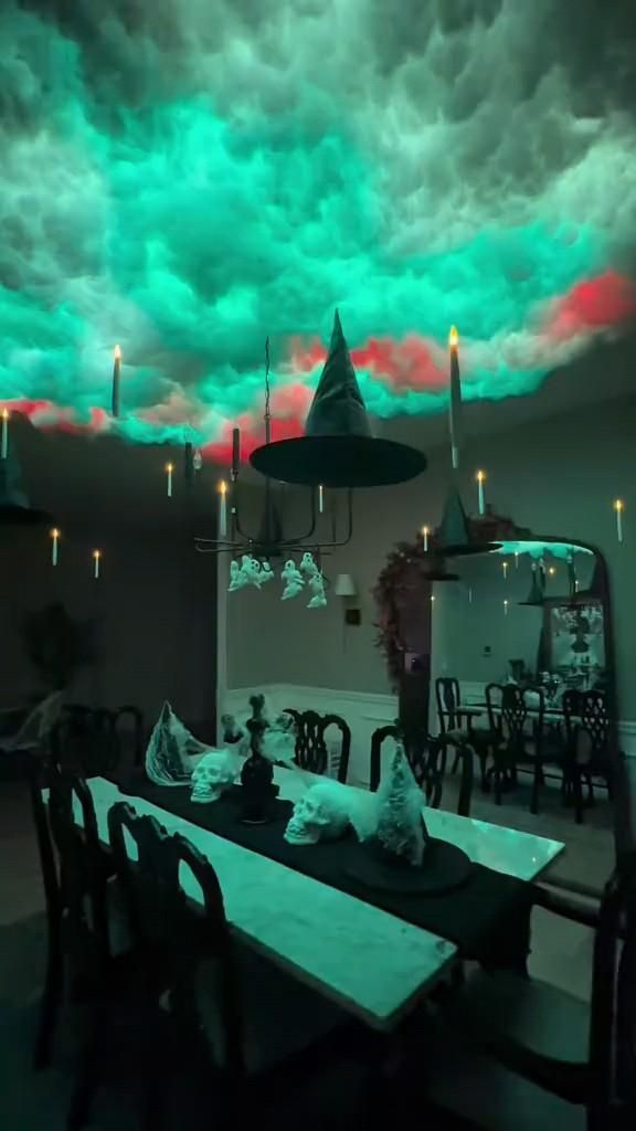 a dining room with green and red clouds in the sky