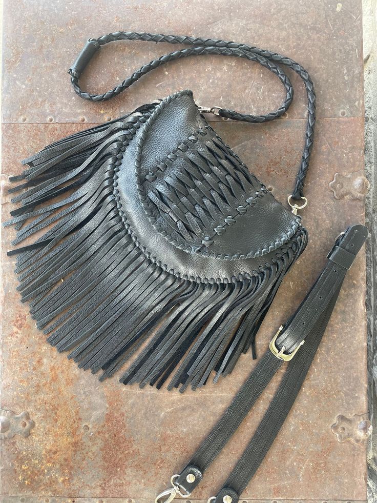 Woven Fringe bag! Beautiful fringy bag with hand woven details. Perfect size for all your small items. 9 inches wide 7 inches tall 2 inch width 1 inside card pocket (leather color may vary, can match if requested) 7 inch fringe Inside is unlined (suede) Entirely hand stitched Magnetic closure  ** Choose your strap style at checkout** Detachable hand braided shoulder strap measures approximately 39 inches Adjustable belted sling strap measures approximately 37 inches total length Leather Clutch Shoulder Bag With Braided Handles, Artisan Shoulder Bag With Fringe For Everyday Use, Fringe Pouch Bag For Everyday Use, Travel Clutch Bag With Fringe, Everyday Top Handle Fringe Shoulder Bag, Handwoven Leather Crossbody Shoulder Bag, Handwoven Leather Crossbody Satchel, Artisan Rectangular Shoulder Bag With Fringe, Travel Fringe Clutch Bag