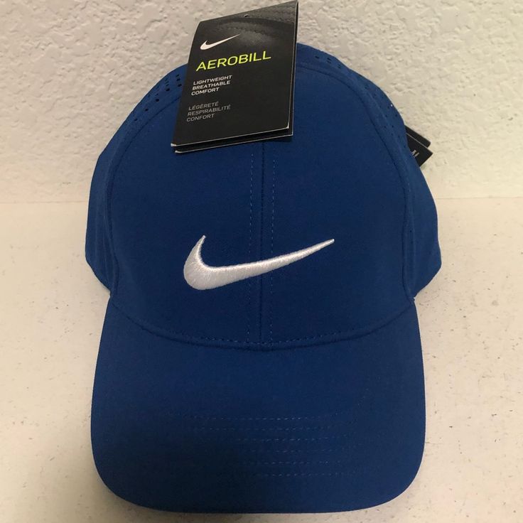 Nike Golf Hat. Medium Blue. Structured Front Along Forehead. One Size. 2 Available. Casual Blue Golf Hat, Blue Sporty Baseball Cap, One Size Fits Most, Sporty Blue Baseball Cap, One Size Fits Most, Sporty Blue Baseball Cap One Size, Sporty Blue Six-panel Baseball Cap, Sporty Blue Baseball Cap One Size Fits Most, Nike Sports Hat One Size, Blue Sports Hat, Blue Sporty Baseball Cap For Sports