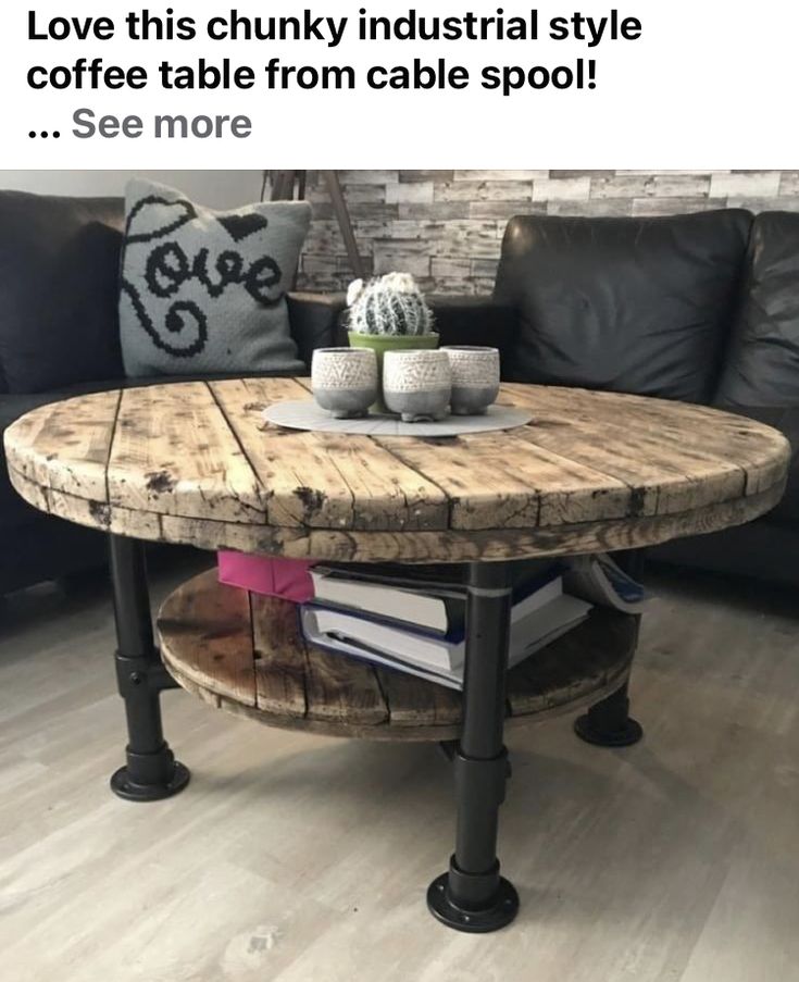 a coffee table made out of an old barrel and some books on the bottom shelf