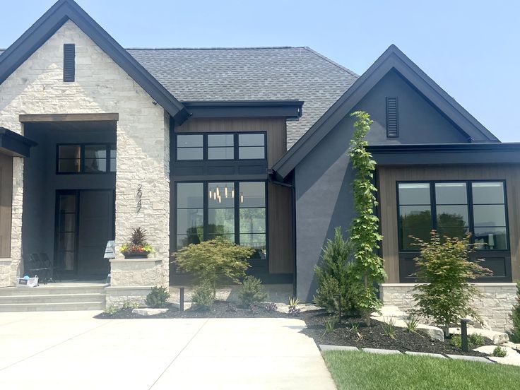 a large gray house with lots of windows