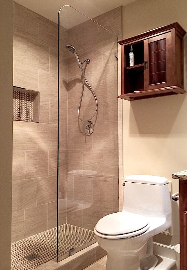 a bathroom with a shower, toilet and sink