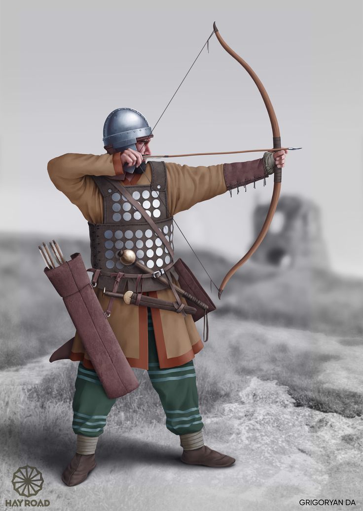 a man dressed as a roman soldier with a bow and arrow in his hand, ready to shoot