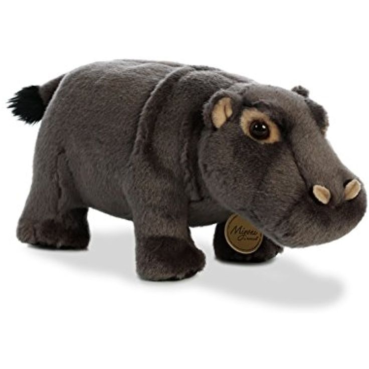 a stuffed hippopotamus is shown on a white background with the head turned to look like it's walking