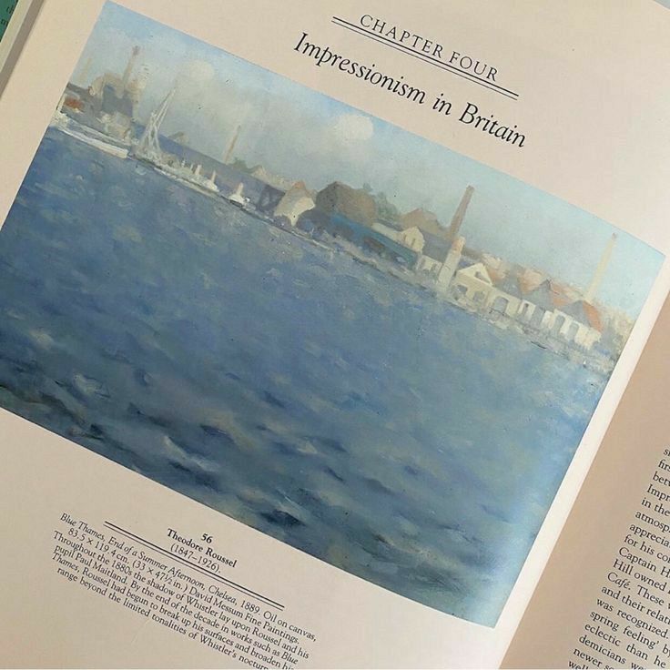 an open book with pictures of boats in the water and buildings on the other side