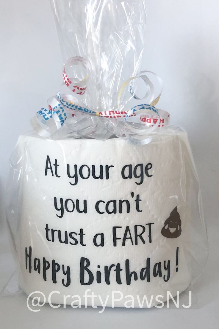 a birthday cake wrapped in plastic with the words at your age you can't trust a far happy birthday