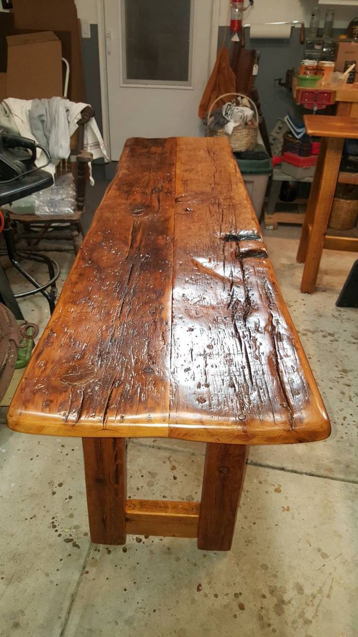 an old wooden table in a garage