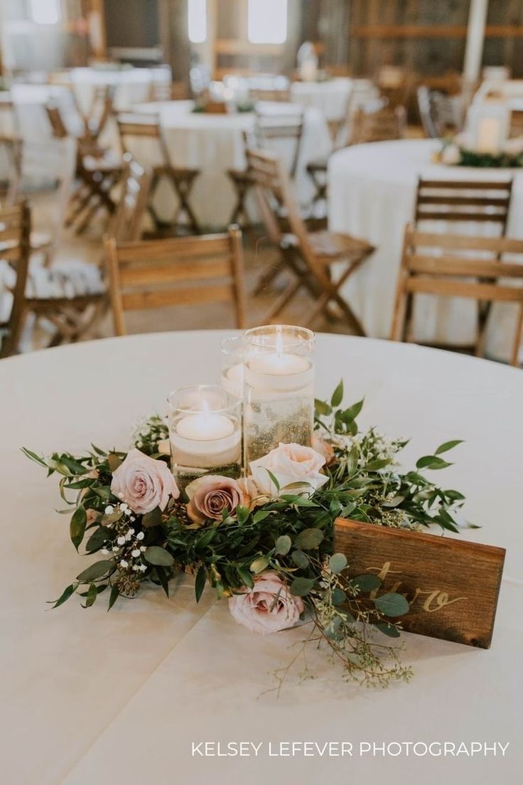 a table with candles and flowers on it