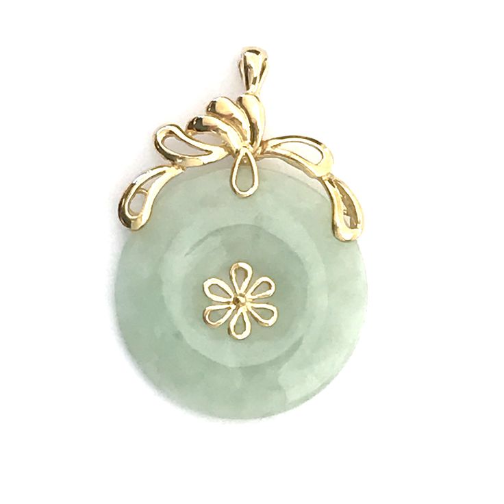 Lovely pendant is a Jade Pi necklace enhancer, a round flat jade with a hole in the middle. A gold clasp allows it to be attached to your chains and beaded necklaces for a variety of looks. ✧ ✧Layaway available✧ ✧ Contact us to set up a plan Era: 1990s Measurements: 37 mm high by 24 mm wide Weight: 5.5 grams Markings 585 and 14K on clasp Gem: pale green jade Vintage condition is mint, like new. A fine pendant in and of itself, you'll love how it will expand the possible looks to your necklace co Gulfport Ms, Scarab Bracelet, Engraved Bangle, Jade Pendant Necklace, Photo Locket Necklace, Gold And Silver Rings, Vintage Jewelry Box, Pearl Crystal, Jade Jewelry