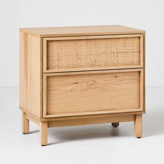 a wooden cabinet with two drawers on one side and an open drawer on the other