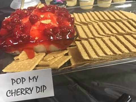 a display case filled with lots of different types of desserts and crackers on top of each other