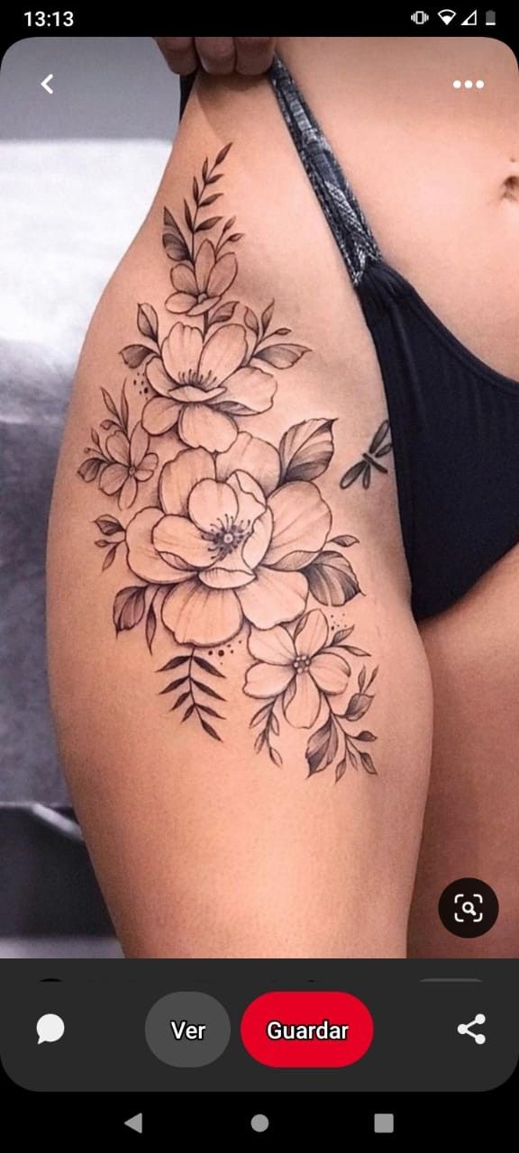 a woman's thigh with flowers on it