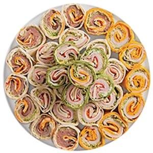 a platter filled with sandwiches on top of a white plate