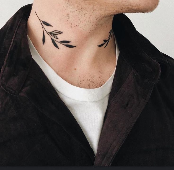 a man with a tattoo on his neck