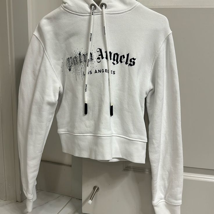 Cropped Diamond Hoodie!! Palm Angels Over Sized A Lil White Logo Hoodie For Spring, White Hoodie With Logo Detail For Spring, White Streetwear Hoodie With Logo, White Logo Hoodie For Winter, White Crew Neck Hoodie With Logo, White Crew Neck Hoodie With Logo Detail, White Sporty Hoodie With Embroidered Logo, Sporty White Hoodie With Embroidered Logo, Trendy White Hoodie With Ribbed Cuffs