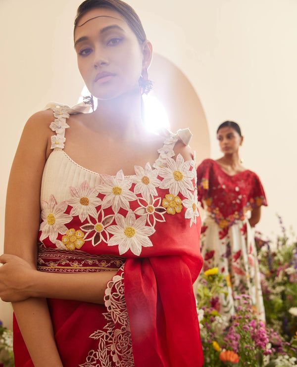 Red organza applique sari with unstitched blouse Red Blouse With Chikankari Embroidery For Wedding, Designer Red Saree With Chikankari Embroidery, Red Chikankari Embroidery Designer Saree, Red Floral Embroidered Saree For Navratri, Red Saree With Floral Embroidery For Navratri, Anarkali Organza Blouse With Floral Embroidery, Designer Red Saree With Floral Embroidery, Red Embroidered Saree Fabric With Sheer Dupatta, Red Chanderi Blouse Piece With Floral Embroidery