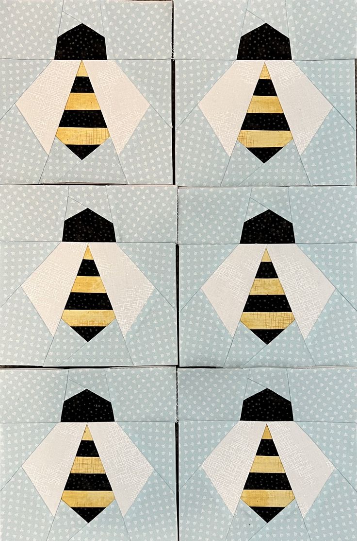 four squares with black and yellow stripes are arranged in the shape of a bee's head