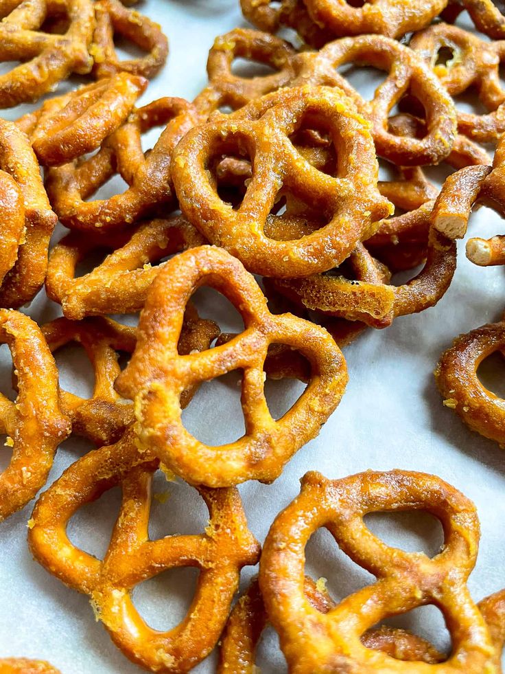 some pretzels are sitting on a white tablecloth and there is no image here to provide a caption for