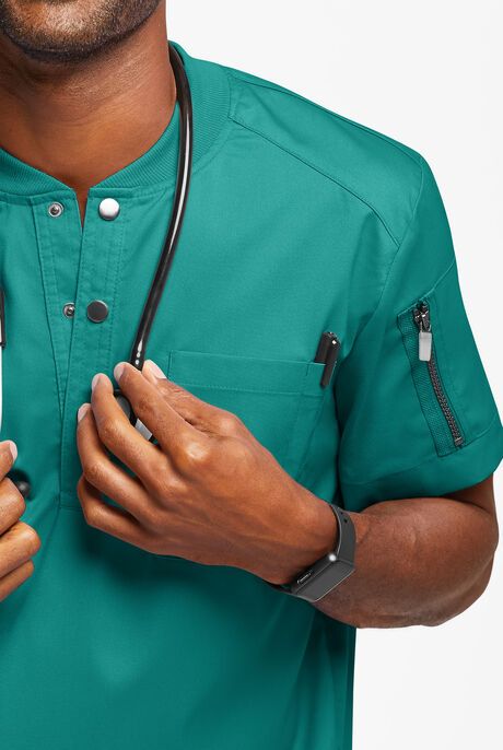 Men's Scrub Tops | Men's Medical Scrubs | Uniform Advantage Clinic Uniform Design, Guys In Scrubs, Doctor Scrubs Fashion Men, Men In Scrubs, Mens Scrubs Fashion, Scrub Designs, Clinic Uniform, Male Scrubs, Shop Uniform