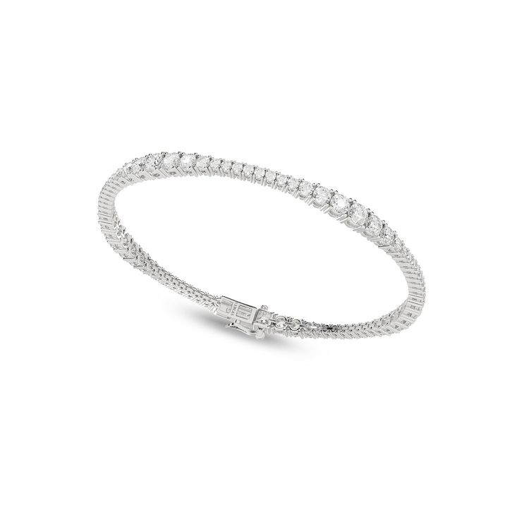 The Charming Tennis Bracelet features a delicate string of linked diamonds, each meticulously poised and set in a classic design that has captivated hearts for generations. Designed to be versatile, it effortlessly complements a wide range of styles and occasions. Adorn your wrist with the diamond tennis bracelet—a testament to the profound simplicity that makes life exquisite. Tennis Bracelet Diamond, Tennis Bracelet, Tennis, Classic Design, Diamond Cuts, White Gold, Gold