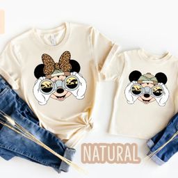 two tshirts with mickey mouse on them and the words natural printed on them