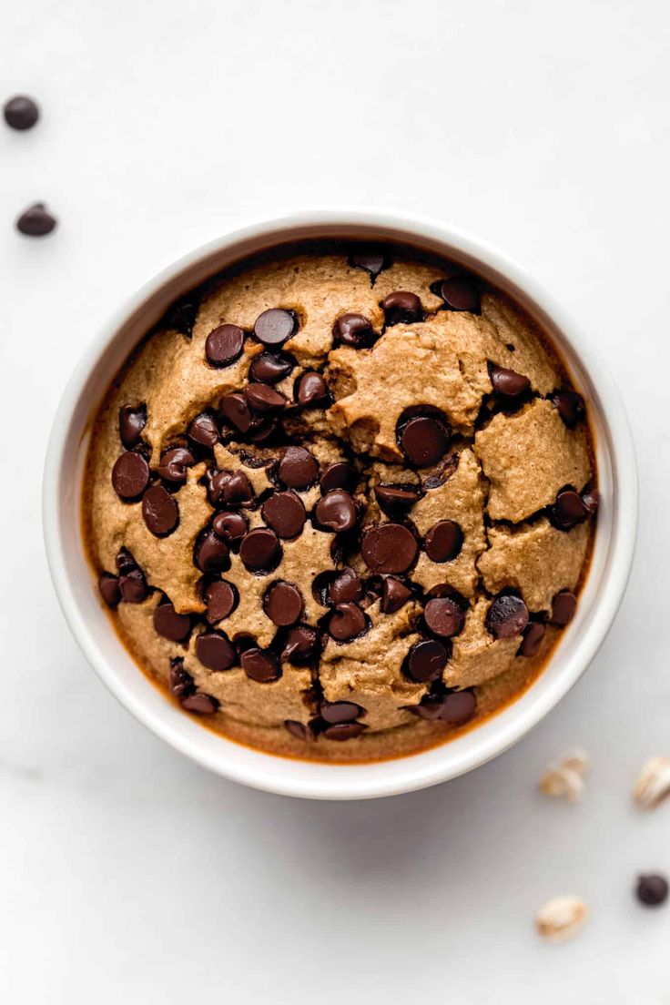 a white bowl filled with chocolate chip cookies