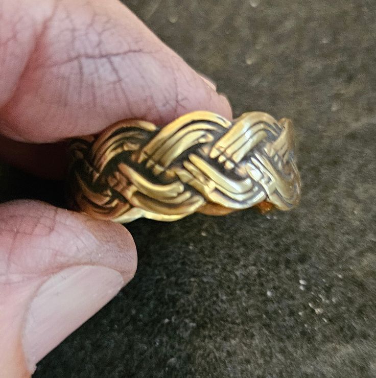 Gorgeous hand-made band. Made from Brass on a weaved pattern. Size 9 7/8 Adjustable Jewelry With Interwoven Design For Gifts, Artisan Braided Jewelry Gift, Artisan Braided Jewelry For Gifts, Handmade Adjustable Bronze Rings, Adjustable Handmade Bronze Rings, Brass Ring, Band Rings, Hand Made, Jewelry Rings