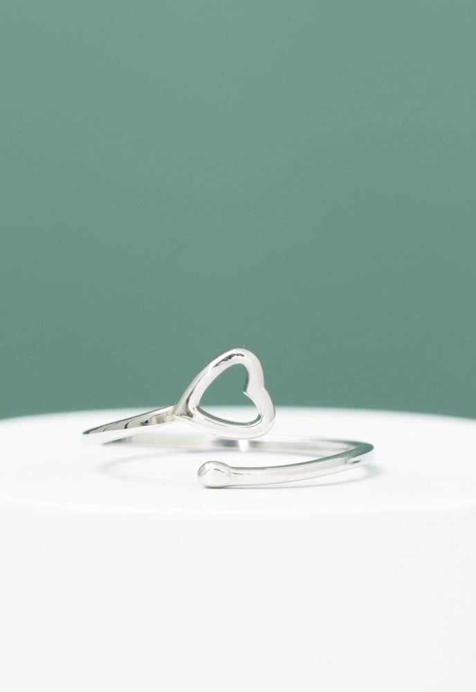 Our sweet Ada Heart Ring is wonderfully adjustable. You don’t have to take our word for it, here’s what customers are saying; “It can fit any finger; so, you can move it around, and it looks great!” + “I love the quality of Starfish Project’s pieces and the mission behind the work. It’s a win-win.” We think they’ve said it perfectly. Win-win indeed! The Ada Heart Ring comes in silver and 14k plated gold. Box size and box color may vary. Materials: 14k gold plated stainless steel heart ring Size: Cute Adjustable Midi Promise Rings, Adjustable Heart-shaped Dainty Midi Rings, Adjustable Heart Ring For Promise On Mother's Day, Adjustable Heart Ring For Promise And Mother's Day, Adjustable Silver Heart Ring For Mother's Day, Minimalist Adjustable Open Heart Ring, Adjustable Minimalist Open Heart Ring, Adjustable Sterling Silver Heart Ring, Adjustable Heart Toe Ring For Promise