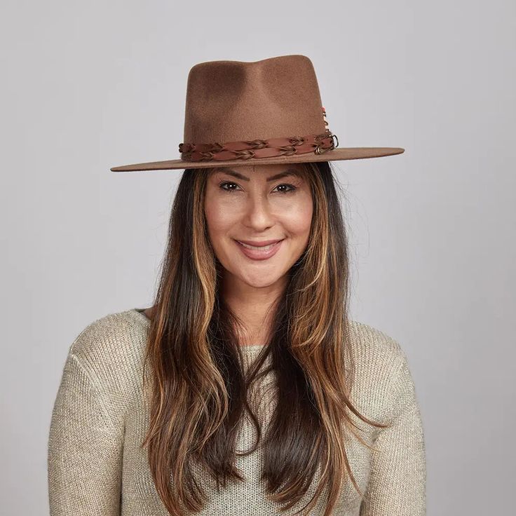 The Aspen Wide Brim Felt Fedora Hat is here to make a statement. This rancher-style hat is the perfect rustic piece to sport for your days in the great outdoors. Spice up any look with our unique braided leather matchstick band and wide smooth brim. Featuring a sewn-in sweatband with a unique hidden pull strap tightening system for a one of a kind fit! Plus we’ll include two adhesive size reducers for an even more custom experience. American Hat Makers, Womens Fedora, Wide Brim Fedora, Felt Fedora, Beach Hat, Fedora Hat, Outdoor Wear, Braided Leather, Summer Hats