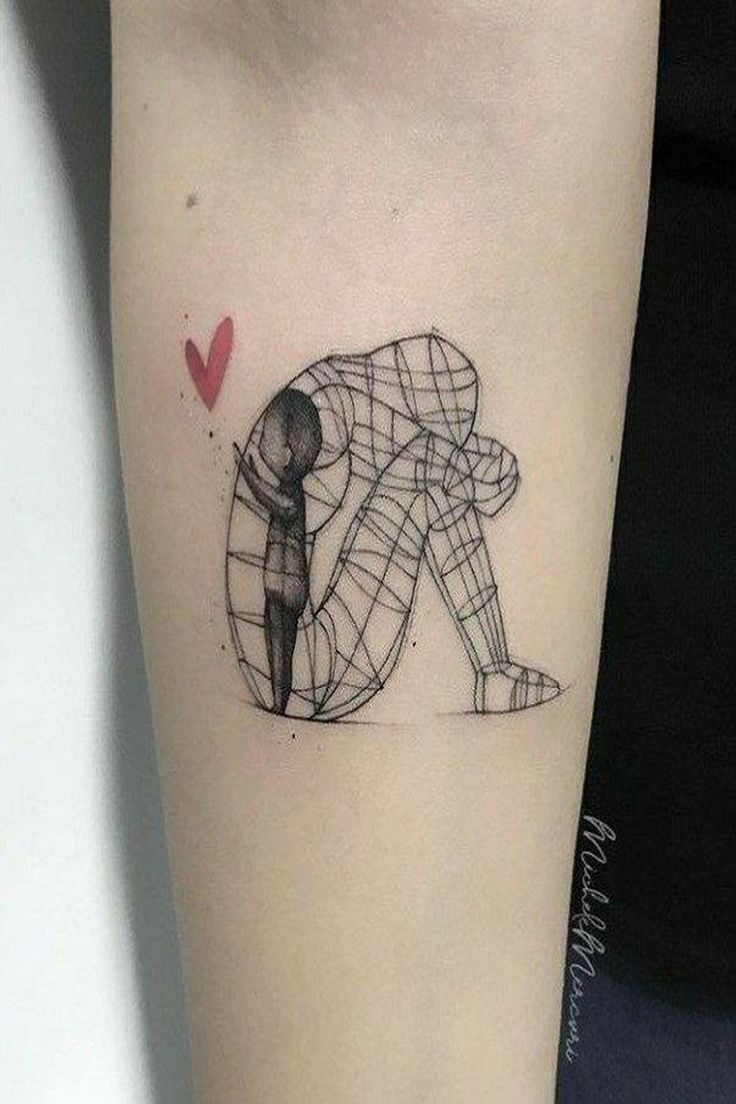 a woman's arm with a tattoo on it that has an image of a man kneeling down