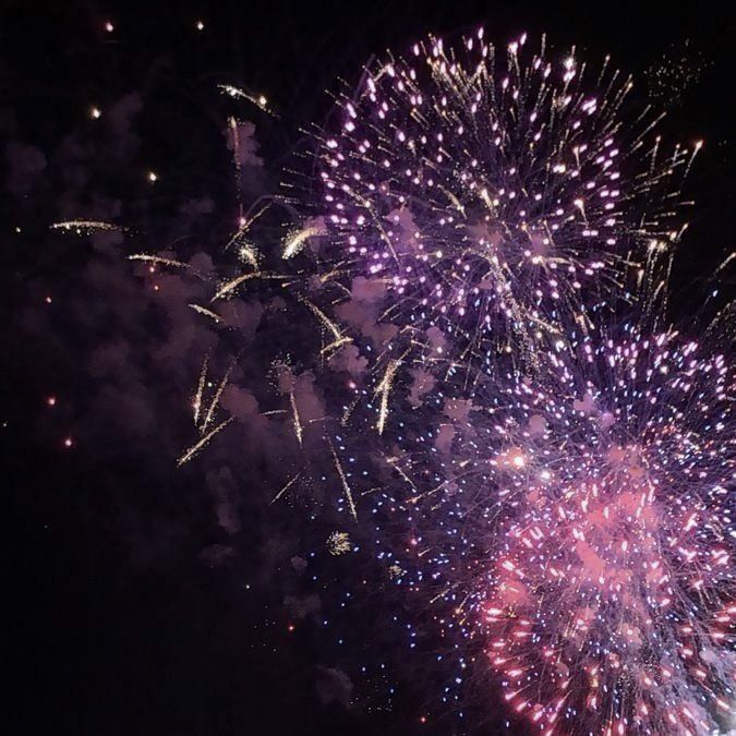 fireworks are lit up in the night sky with bright colors and sparkles on them