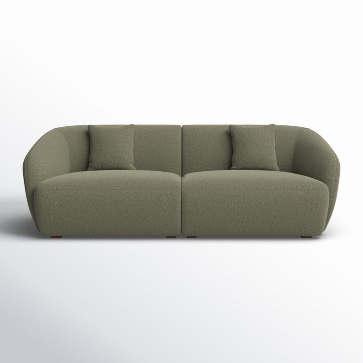 an image of a couch with pillows on the top and bottom part of it's back