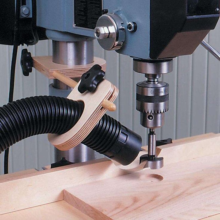 a machine that is working on some kind of thing in the woodworking area with it's tool