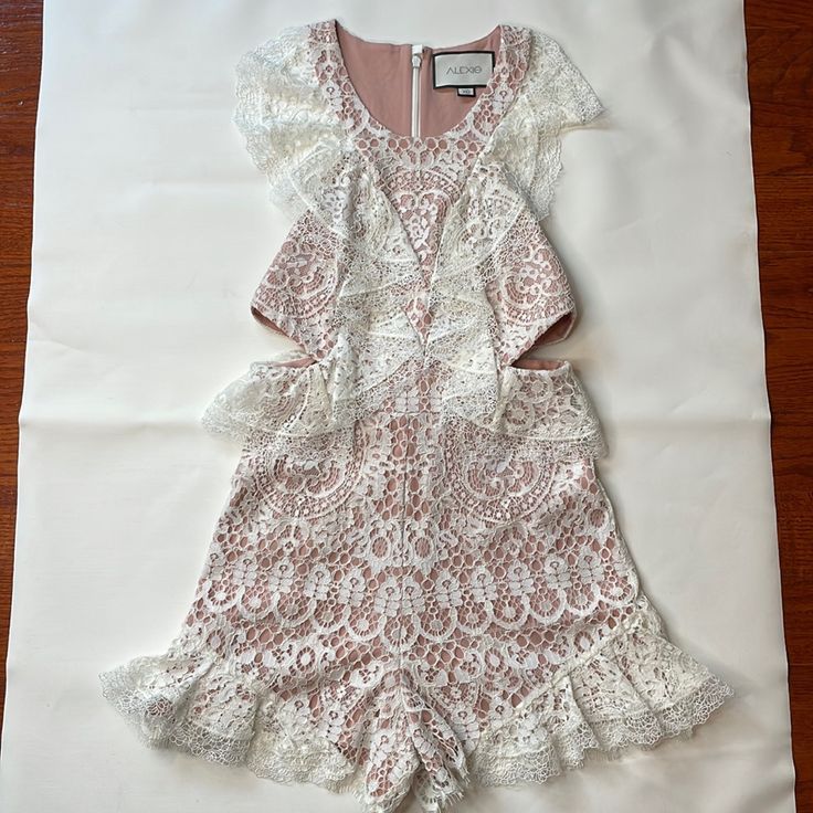 Romper For The Bride Made By Alexis. Never Been Worn. Size Xs. Fits Bigger. Long For Anyone That's Petite. Fitted Sleeveless Jumpsuits And Rompers With Lace Trim, Fitted Sleeveless Jumpsuit With Lace Trim, Elegant Lace Jumpsuits And Rompers For Spring, White Fitted One-piece Jumpsuits And Rompers, Fitted White One-piece Jumpsuit, White Fitted One-piece Jumpsuit, White Fitted Short Sleeve Jumpsuits And Rompers, Elegant White Jumpsuits And Rompers With Lace Trim, White Fitted Short Sleeve Jumpsuit