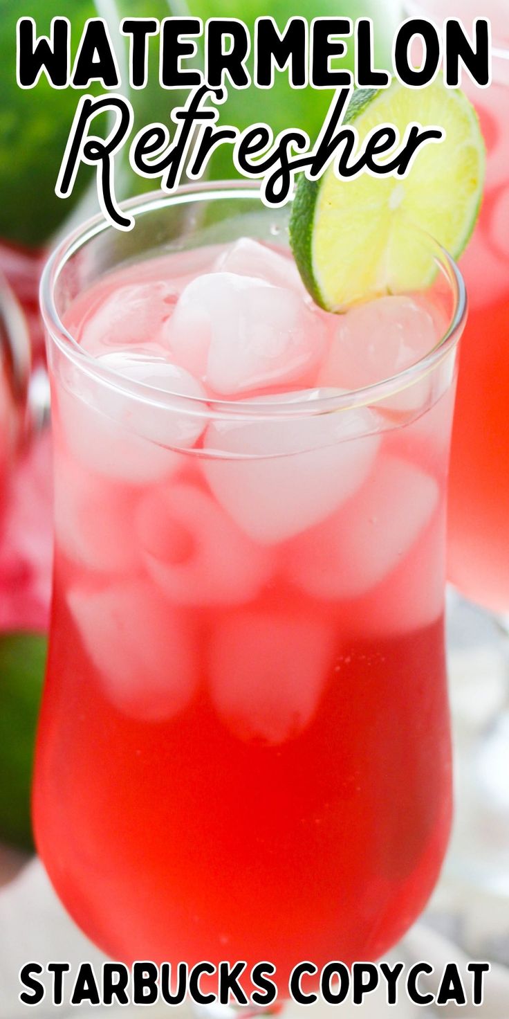 a close up of a drink in a glass with ice and watermelon on the rim