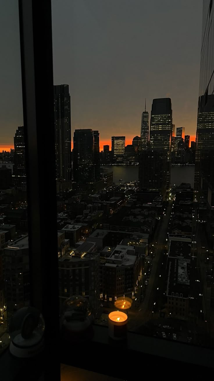 a view of the city at night from a high rise building